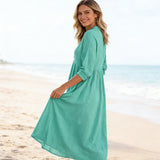 Close-up of the elegant V-neck design on a women's casual V-neck midi dress, highlighting the neckline.
